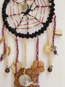 Detail: crocheted tails and wooden pendants